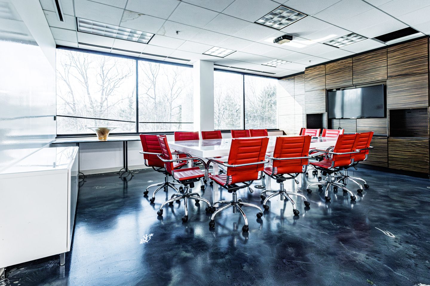 Modern office space with red chairs