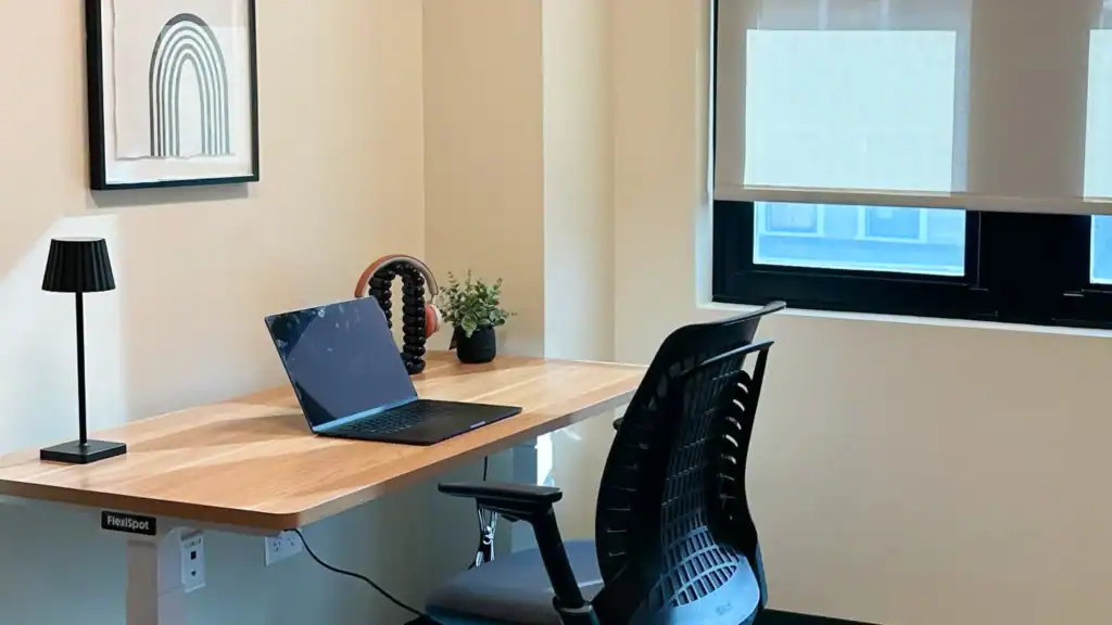 Private office space with desk and chairs